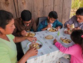 The García family eats lunch together with food from their farm