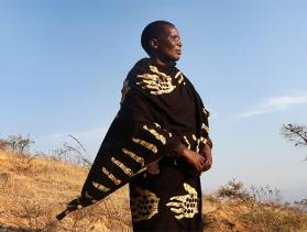 Yasinta Amsi, Saramay Hill catchment committee secretary stands in a ridge that her community constructed to prevent soil erosion in Karatu, Tanzania.