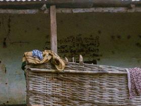 woman wearing mask facing camera in Guinea Bissau