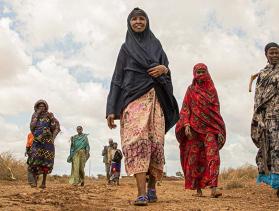 Women in Kenya walking toward camera