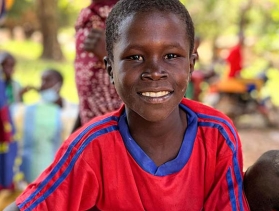 young boy in Central African Republic smiling facing camera 