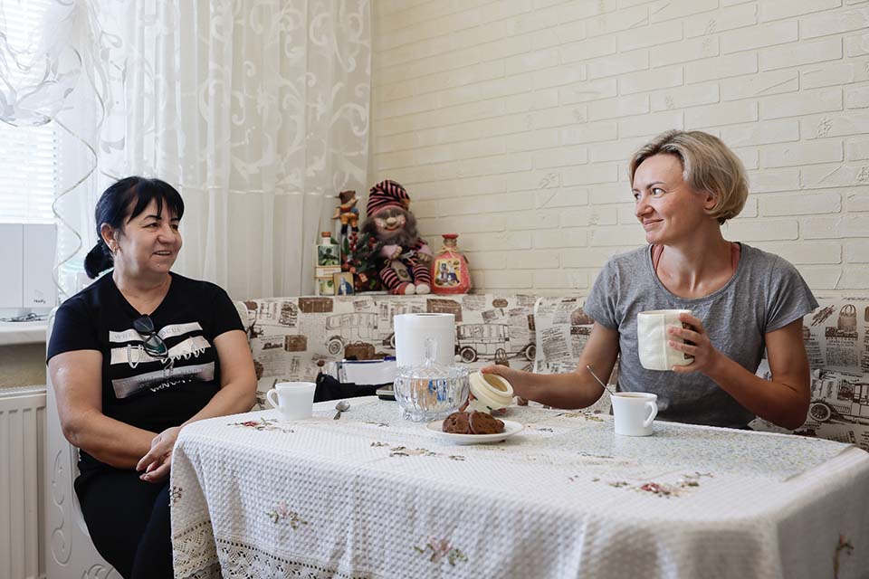 two women at a table in Moldova