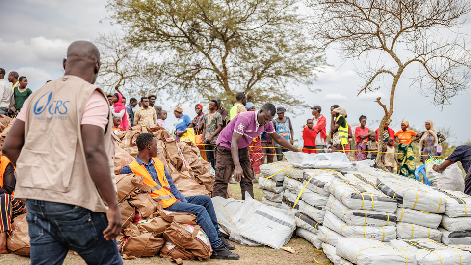CRS staff distributing commodities.