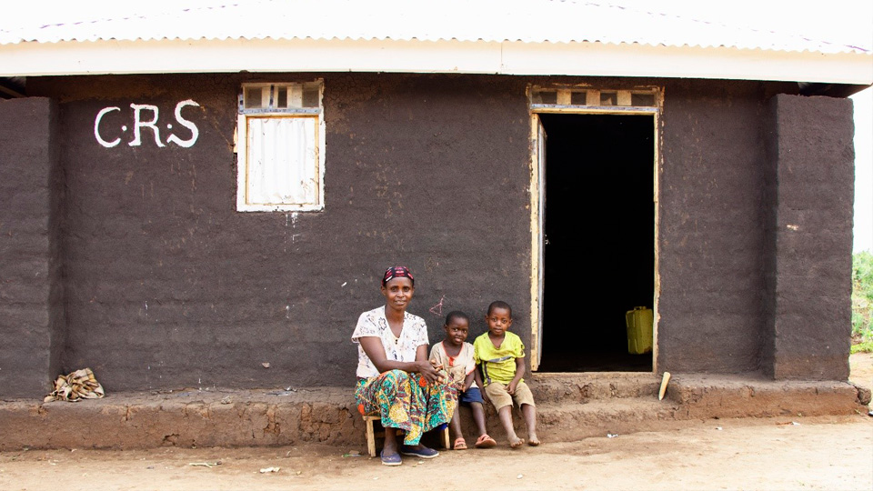 People sitting in front of a building.