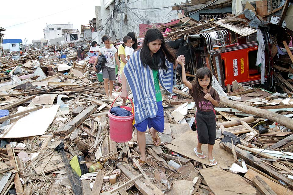 crowd around van in Philippines