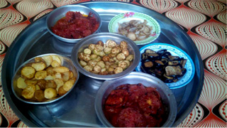 A banquet of fresh vegetables cooked by a displaced Yazidi family--just one example of the tremendous generosity I’ve encountered during my reporting trip to Iraqi Kurdistan. Photo by Nikki Gamer/CRS