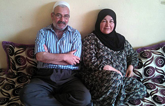 Salahaldin Yaseen and his wife of 40 years photographed in their daughter’s rented home in the Akre distict of Iraqi Kurdistan. Of his wife, Salahaldin says, “She is my heart.” Photo by Nikki Gamer/CRS